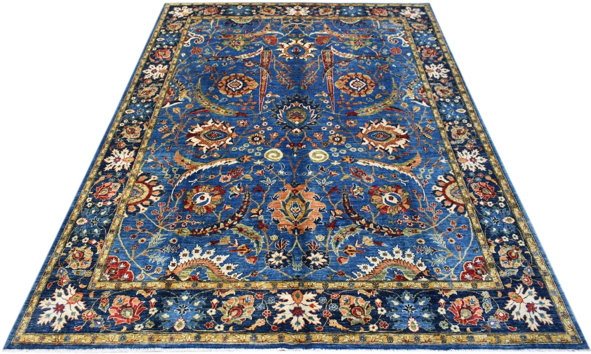A rectangular Afghan Chobi rug featuring intricate floral patterns in blue, red, and gold tones.