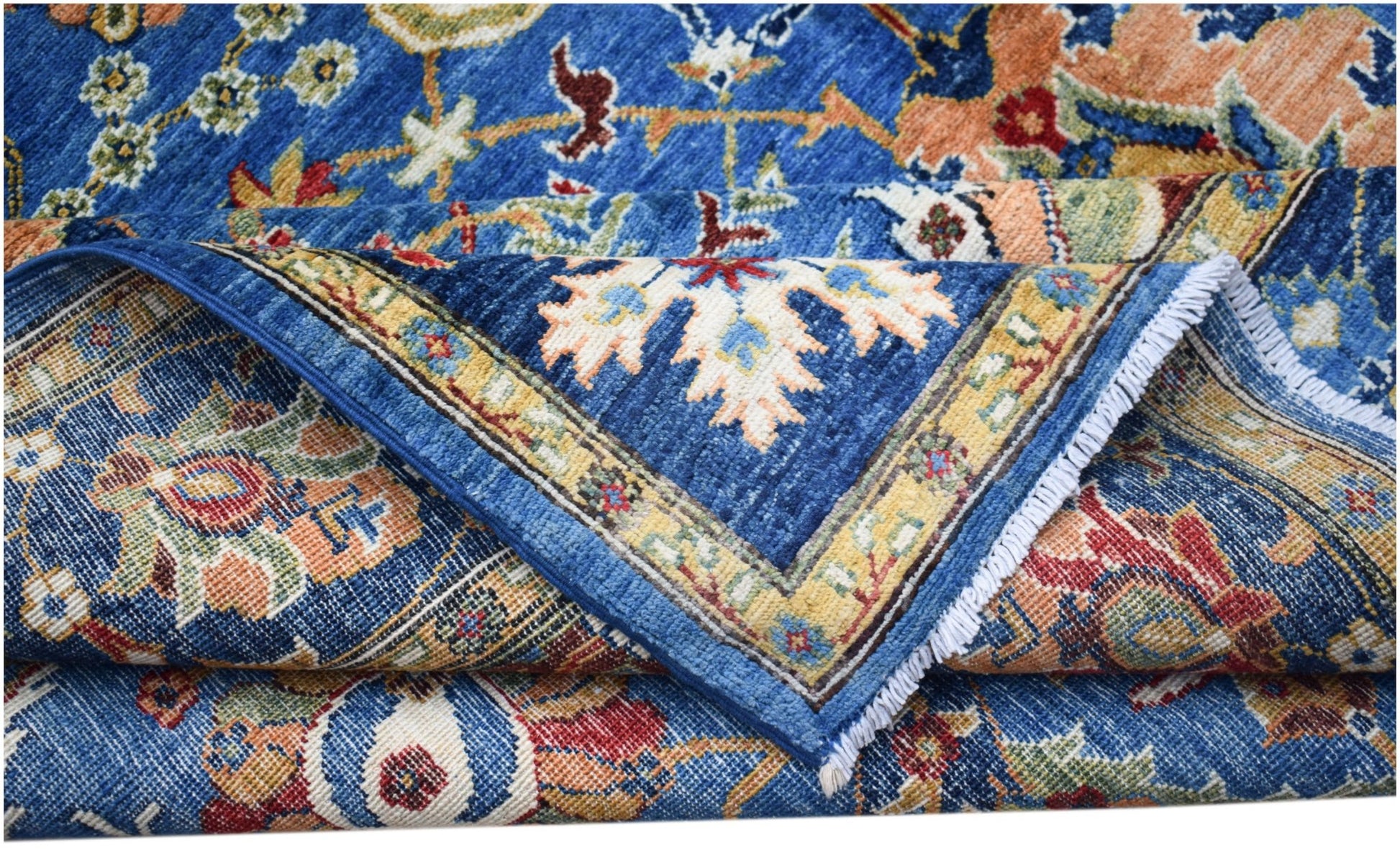 A handwoven Afghan Chobi rug featuring a traditional floral pattern in blue, red, and gold tones.