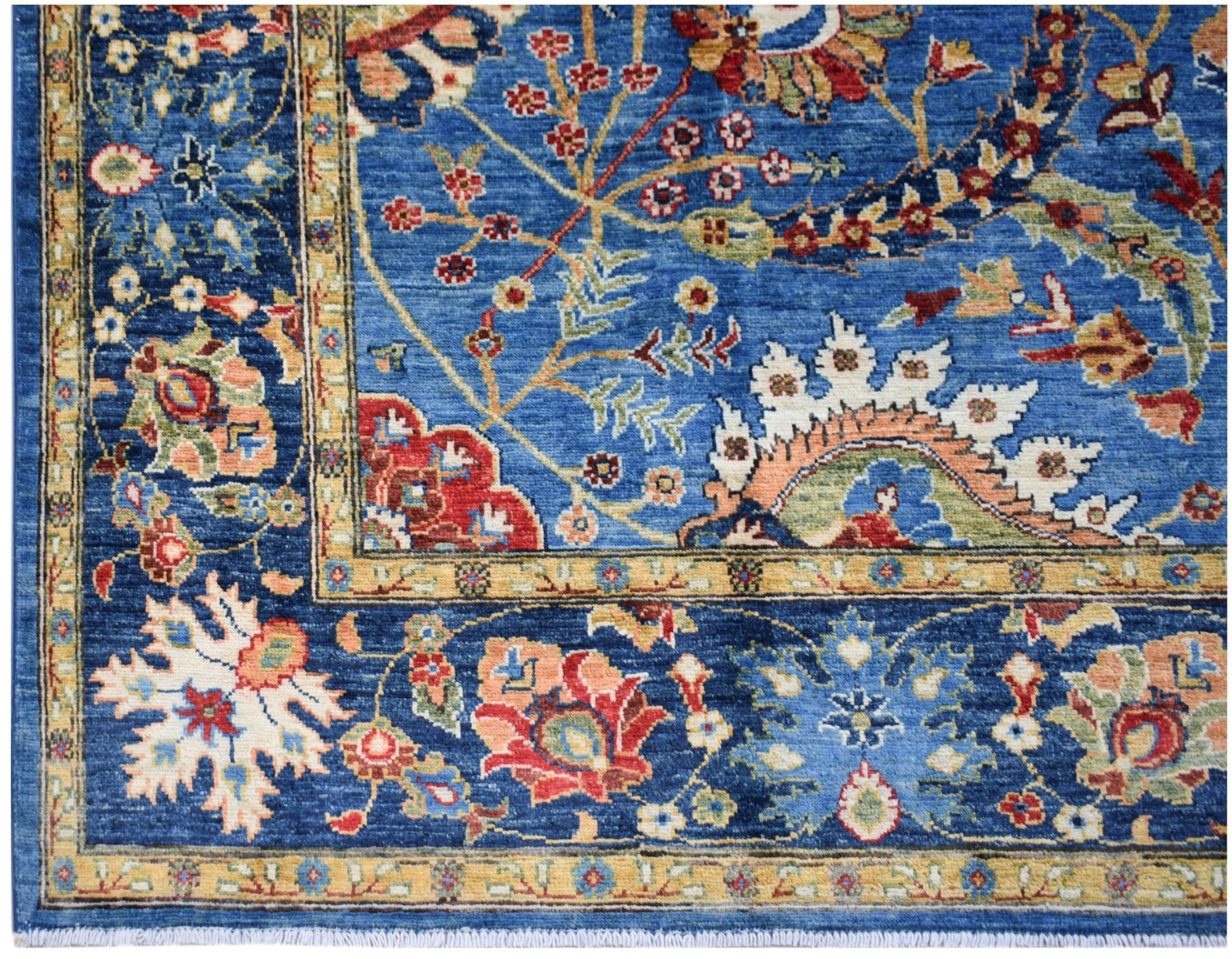 A handwoven Afghan Chobi rug featuring intricate floral patterns in blue, red, and cream tones.