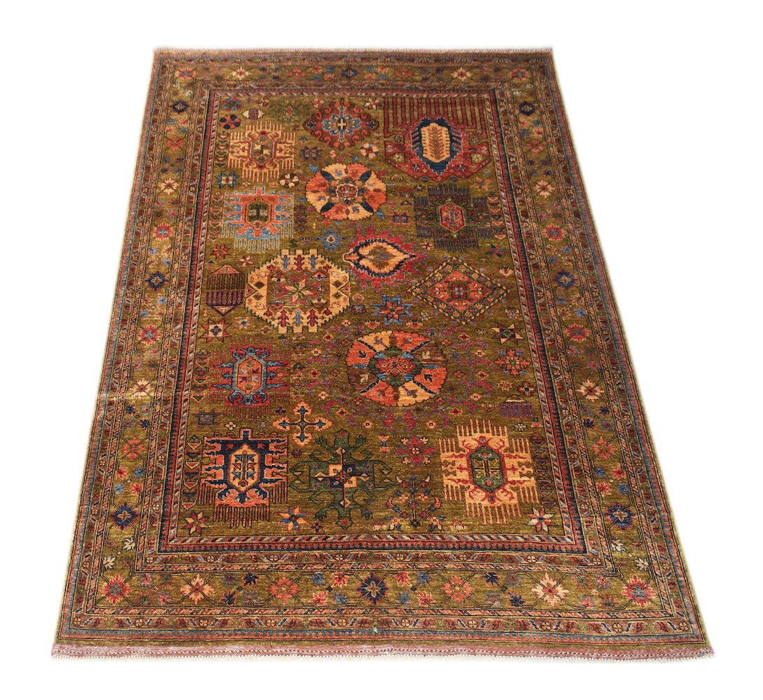 Handwoven Afghan Chobi rug featuring a traditional geometric pattern in earthy wood tones.