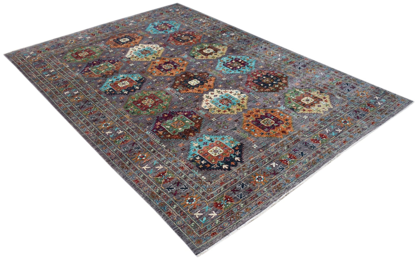 A rectangular Afghan Chobi rug featuring a grey field with colorful geometric medallion patterns.