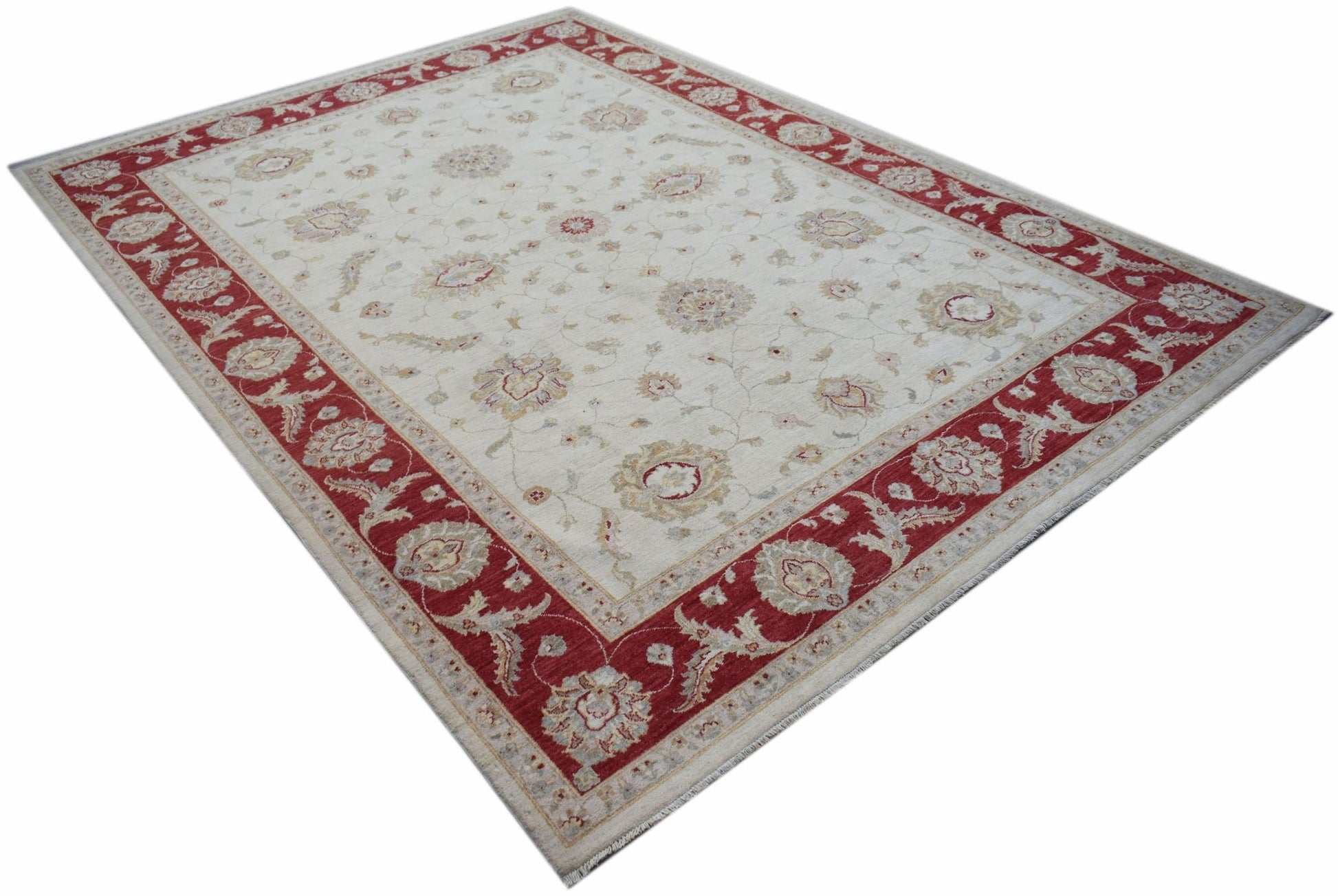 A rectangular Afghan Chobi rug featuring a cream field with floral motifs and a red border.