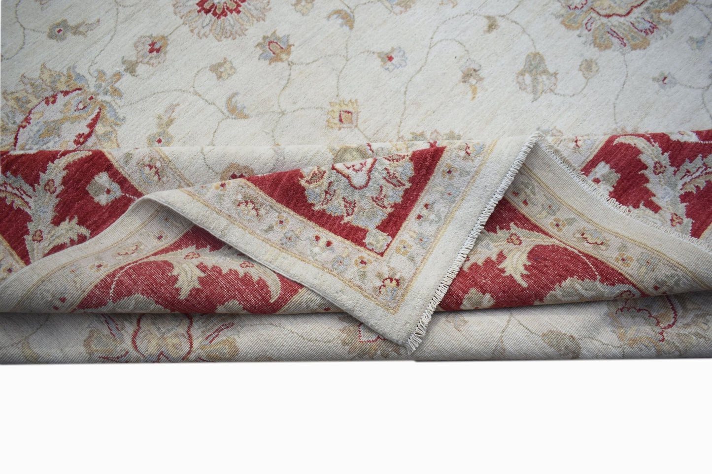 A handwoven Afghan Chobi rug featuring a cream field with floral motifs and a red border.