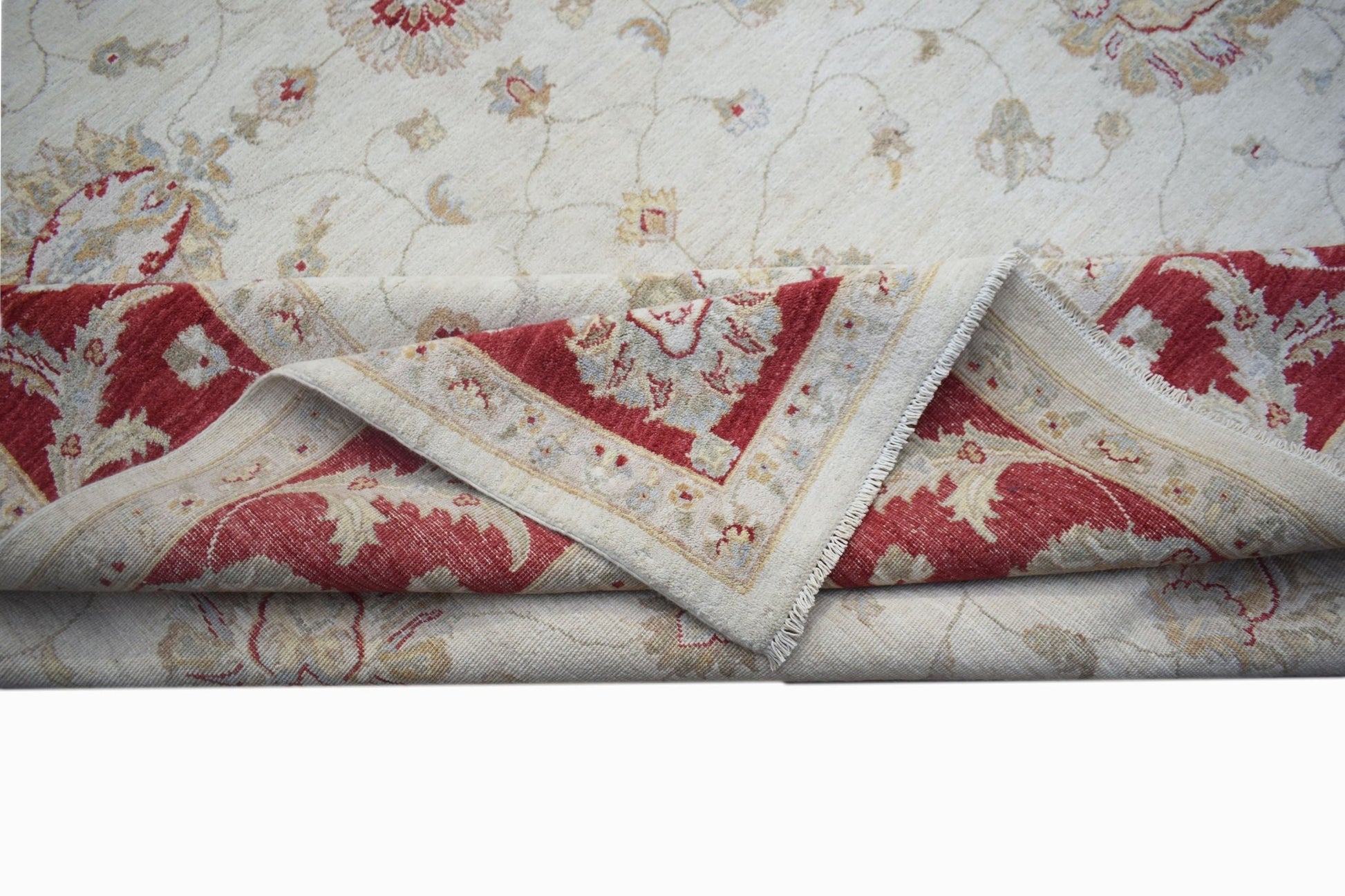 A handwoven Afghan Chobi rug featuring a cream field with floral motifs and a red border.