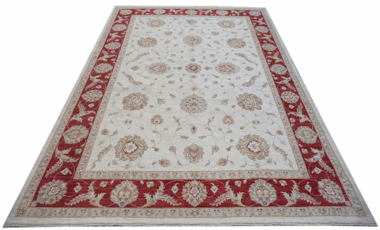 A rectangular Afghan Chobi rug featuring a cream field with floral motifs and a red border.
