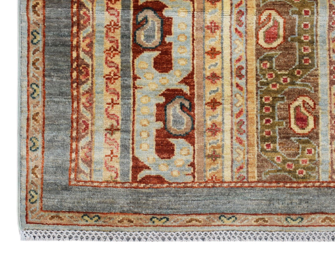 A handmade Afghan Chobi runner featuring traditional geometric patterns in earthy tones.