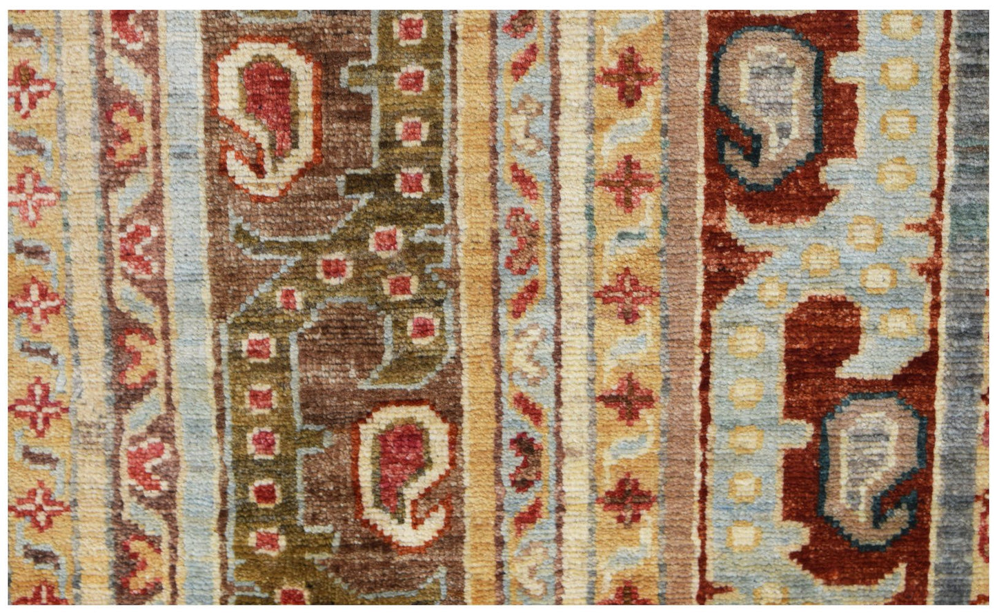 A handwoven Afghan Chobi runner featuring traditional paisley motifs in earthy tones.