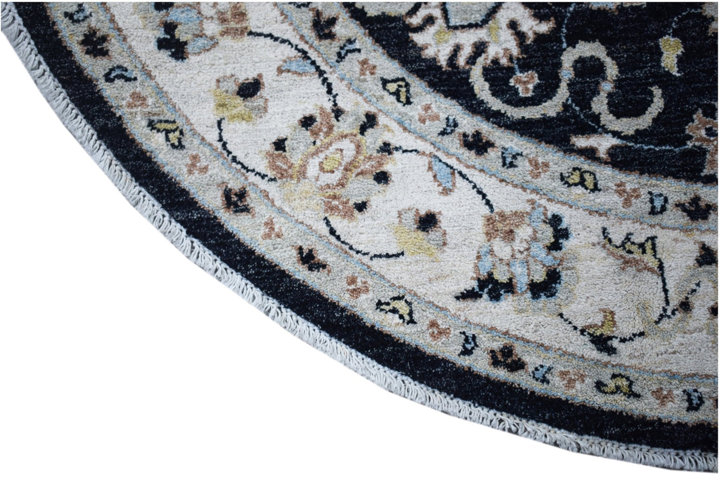A round, handwoven Afghan Chobi rug featuring intricate floral patterns in a cream and black border.