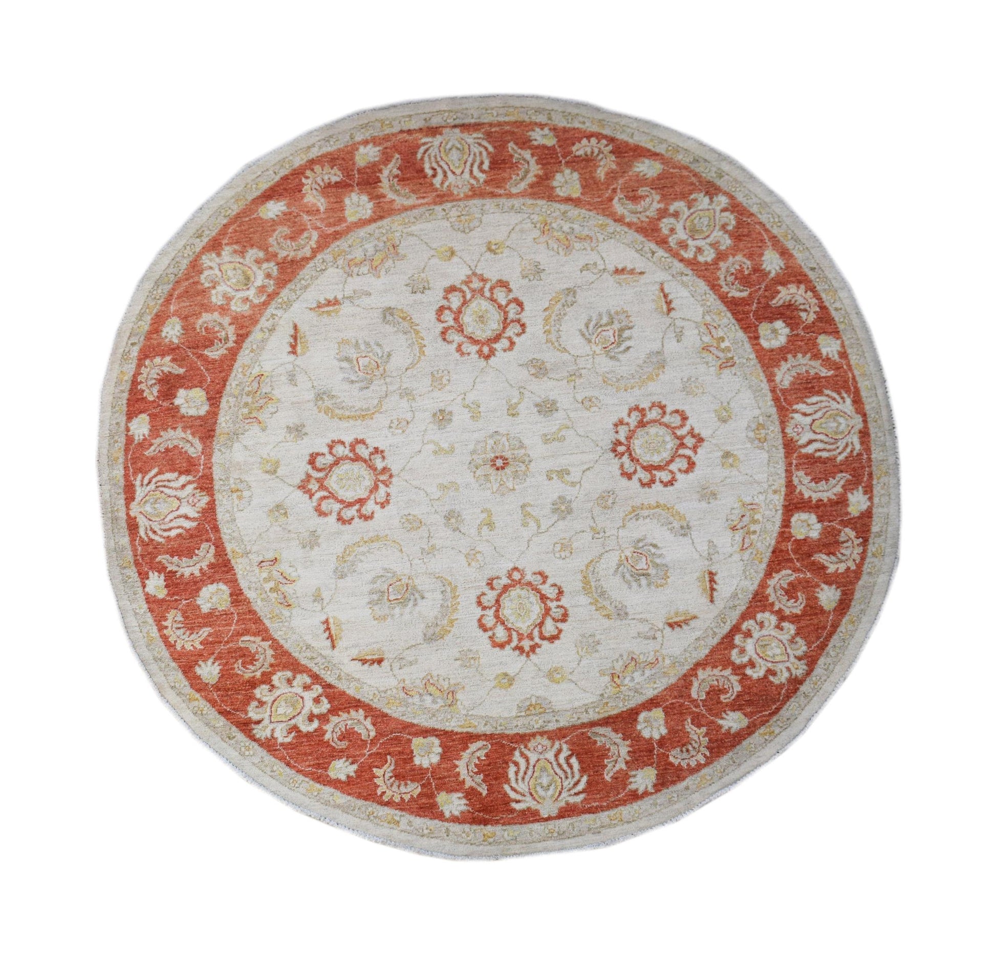 A round Afghan Chobi rug featuring a traditional floral pattern in shades of orange and cream.