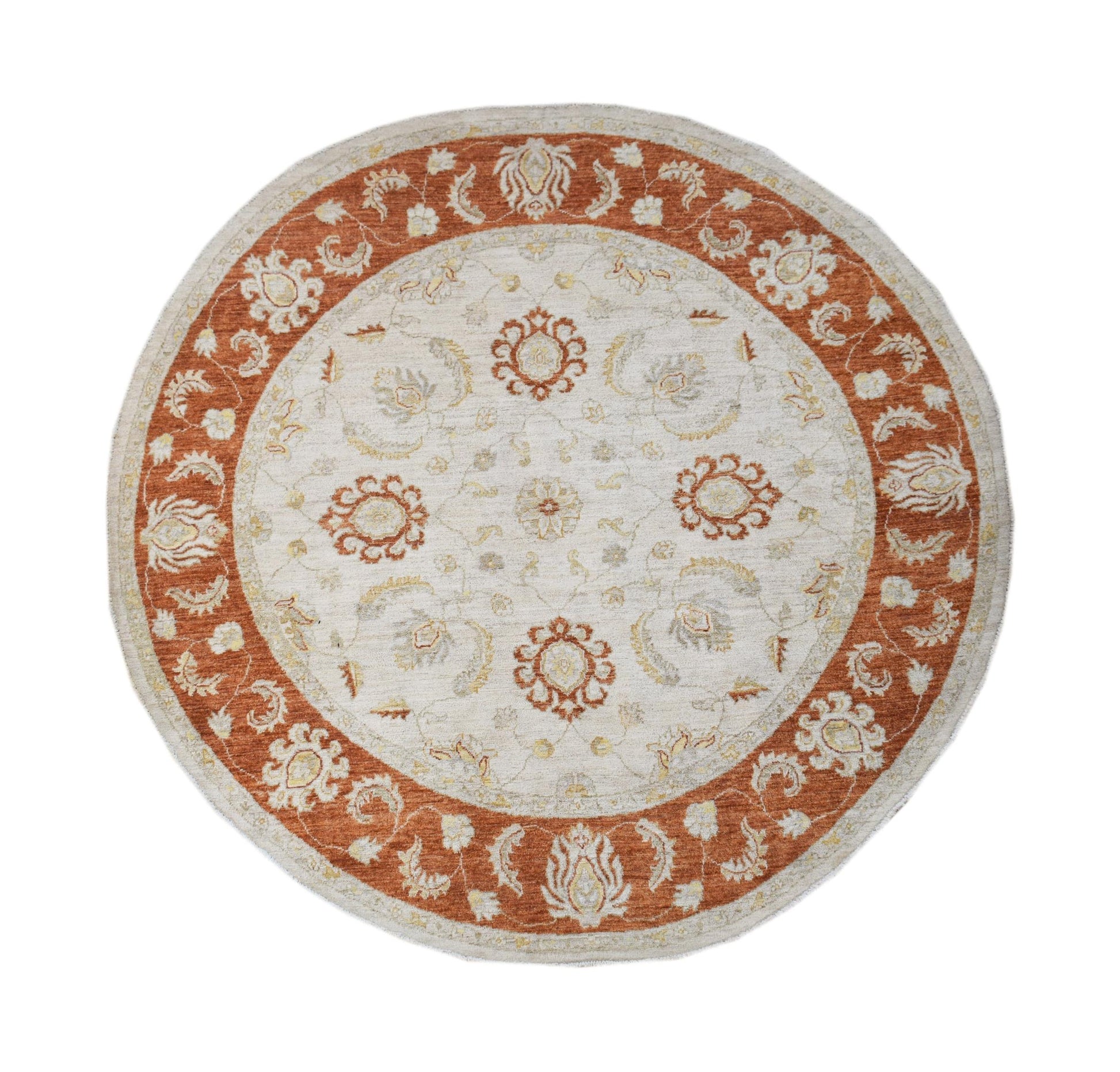 A round Afghan Chobi rug featuring a cream center with rust-colored floral patterns and borders.