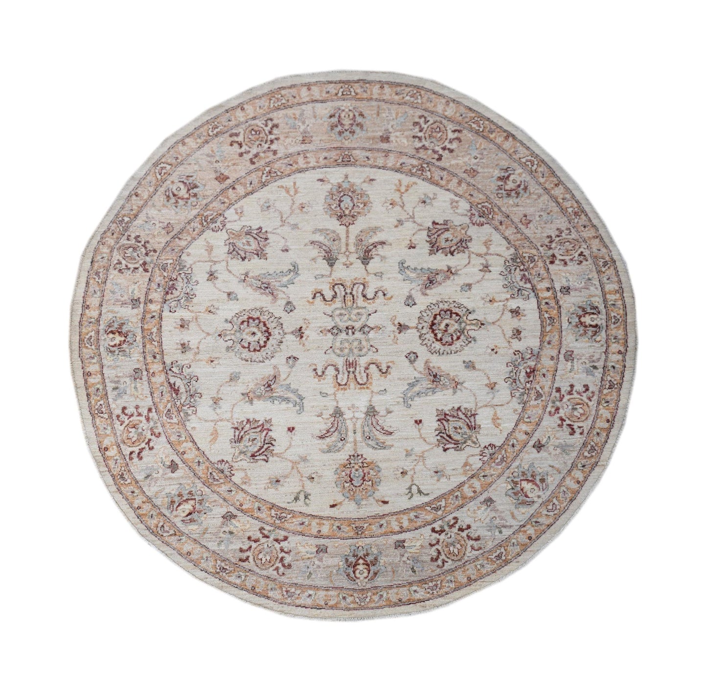 A round Afghan Chobi rug featuring a traditional floral pattern in soft, earthy tones.
