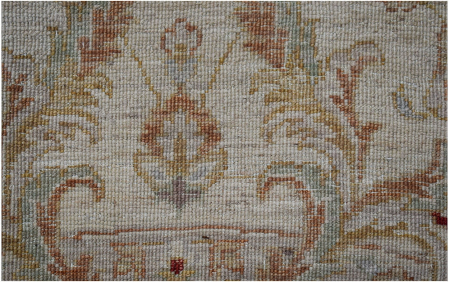 A close-up of an Afghan Chobi rug featuring intricate floral patterns in earthy, wood-toned hues.