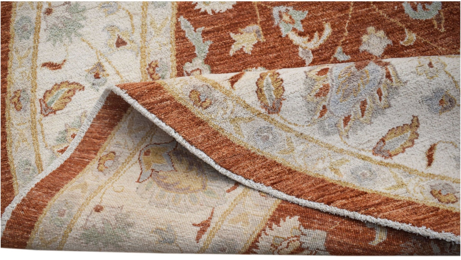 A handwoven Afghan Chobi rug featuring a traditional floral pattern in rust and cream tones.