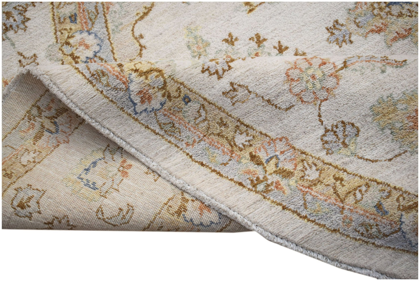 A handwoven Afghan Chobi rug featuring a traditional floral pattern in soft, earthy tones.