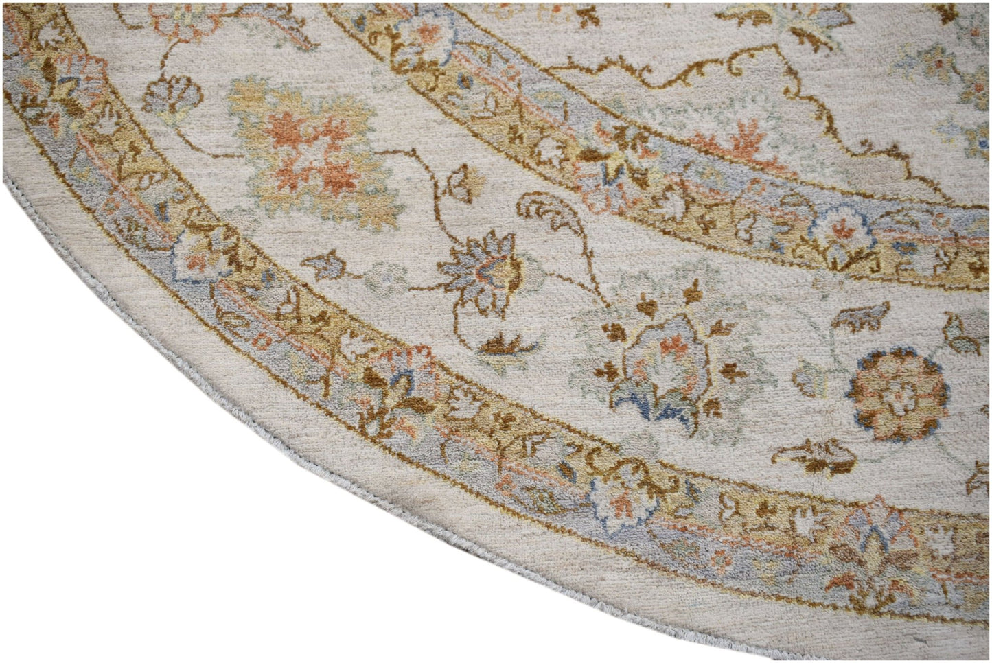 A round Afghan Chobi rug featuring traditional floral patterns in soft earth tones.