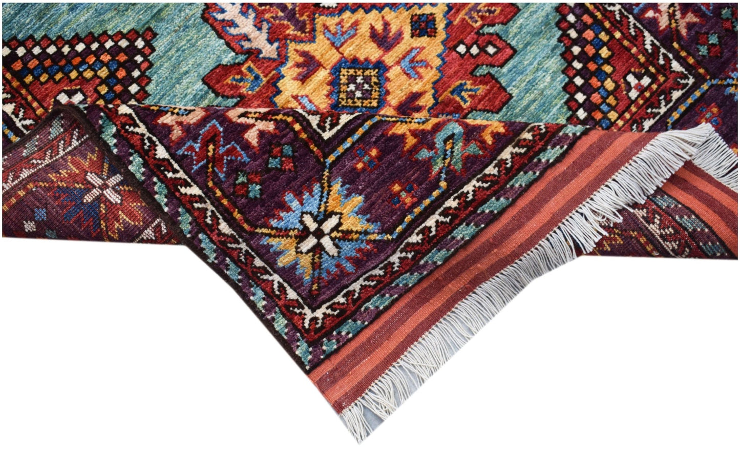 A handwoven Afghan Herati runner featuring a vibrant geometric pattern in wool with fringe ends.