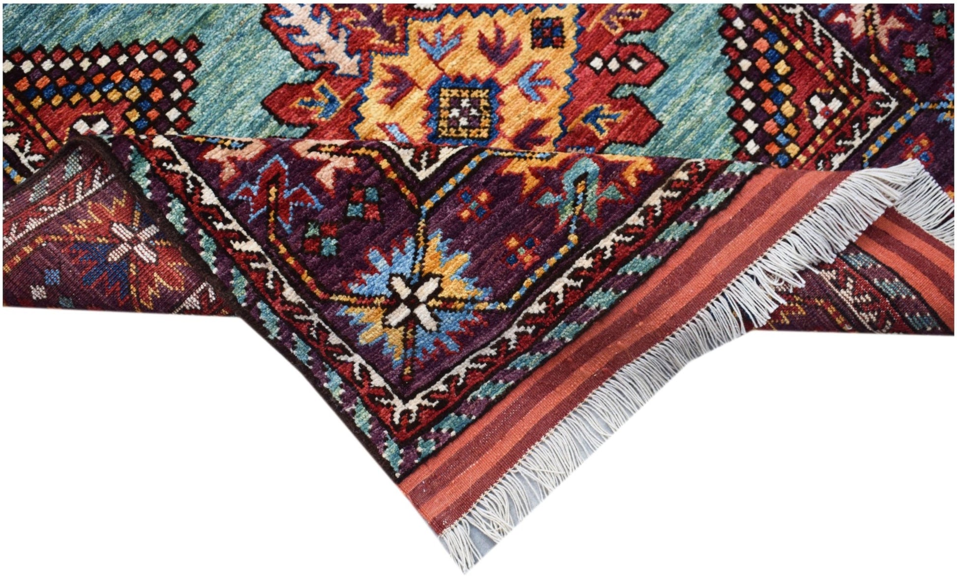 A handwoven Afghan Herati runner featuring a vibrant geometric pattern in wool with fringe ends.