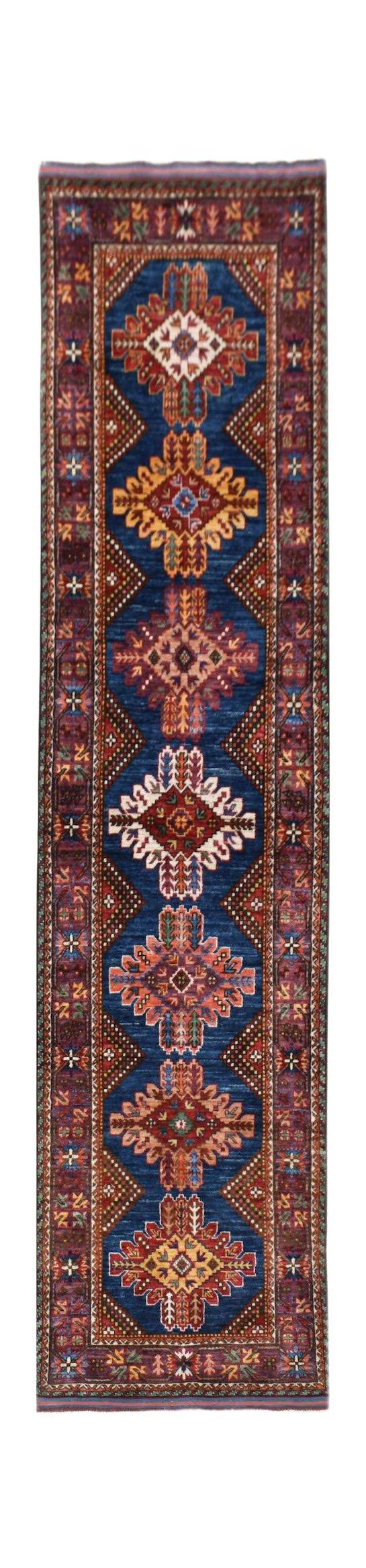 Handwoven Afghan Herati runner rug featuring a blue field with repeating geometric floral motifs.