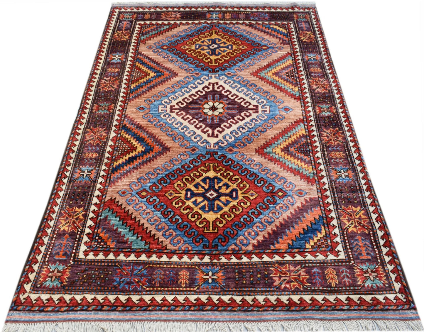 A rectangular Afghan Herati rug featuring three large diamond medallions in vibrant colors.
