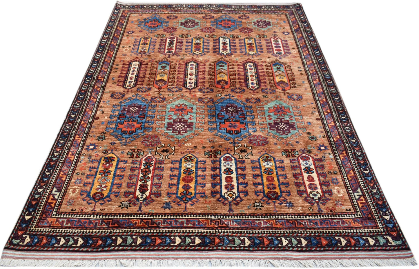 A rectangular Afghan Herati rug featuring a brown field with geometric patterns and a fringed edge.