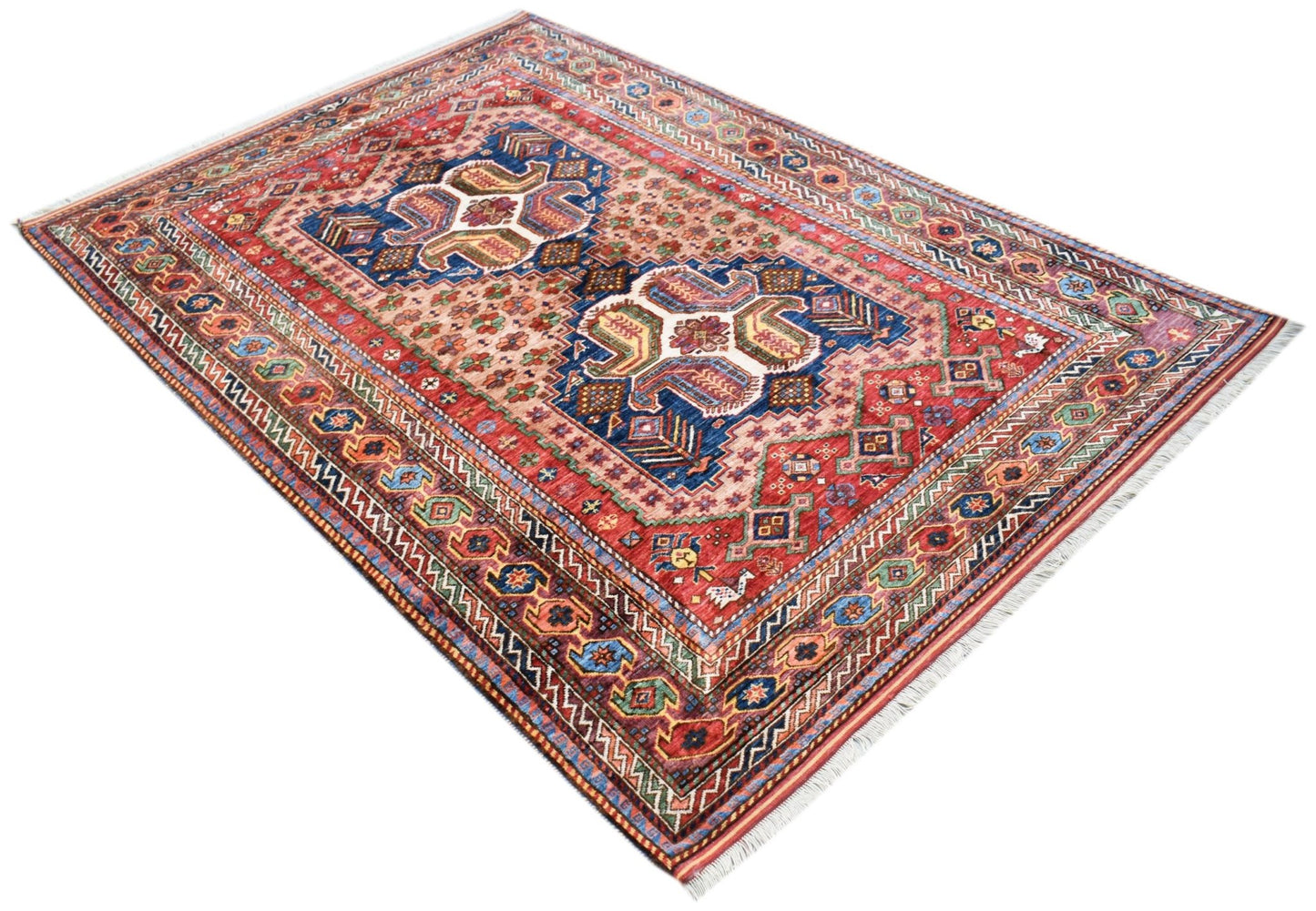 A rectangular Afghan Herati rug featuring intricate geometric patterns in red, blue, and cream.