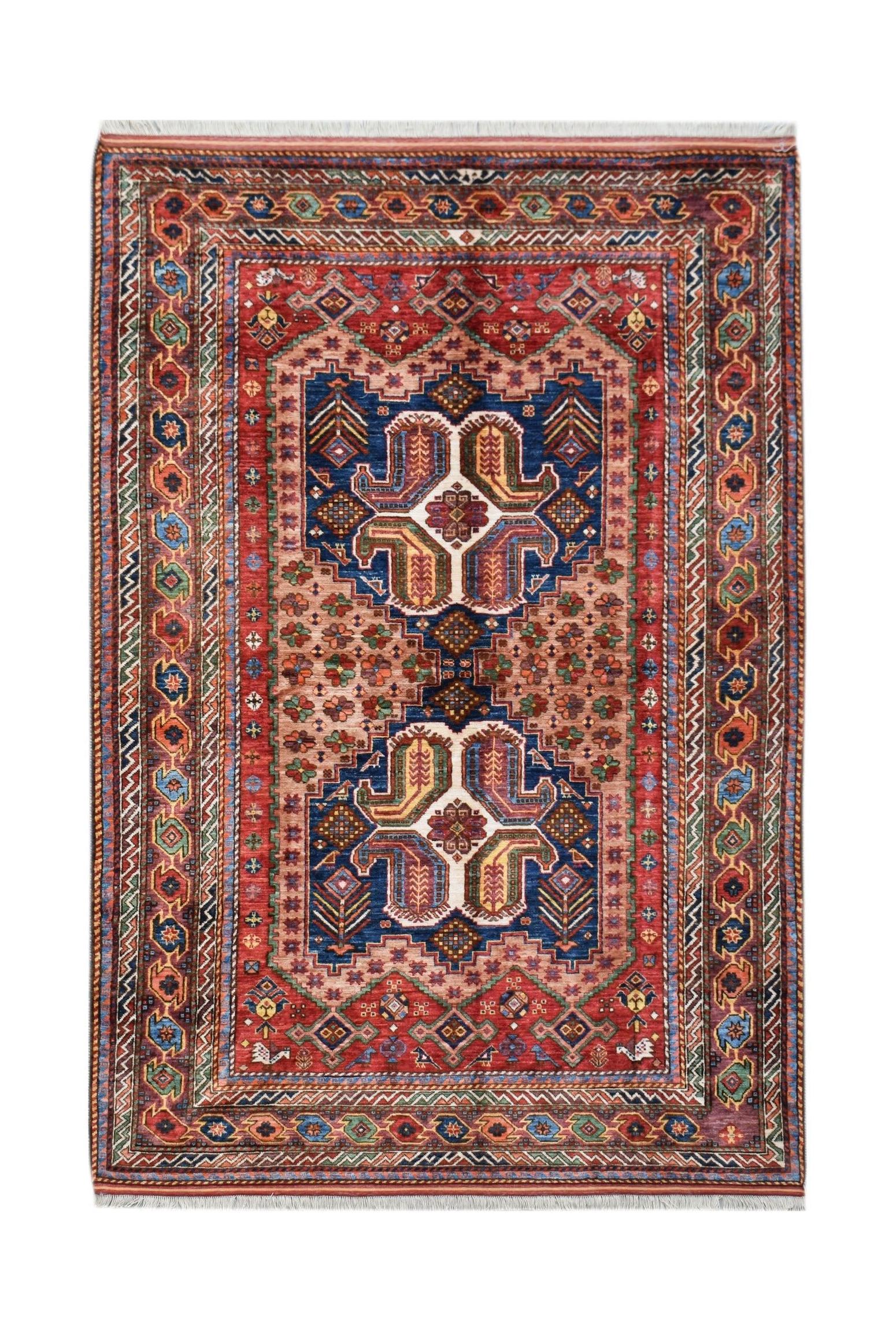 Handwoven Afghan Herati rug featuring a traditional geometric pattern in red, blue, and tan tones.