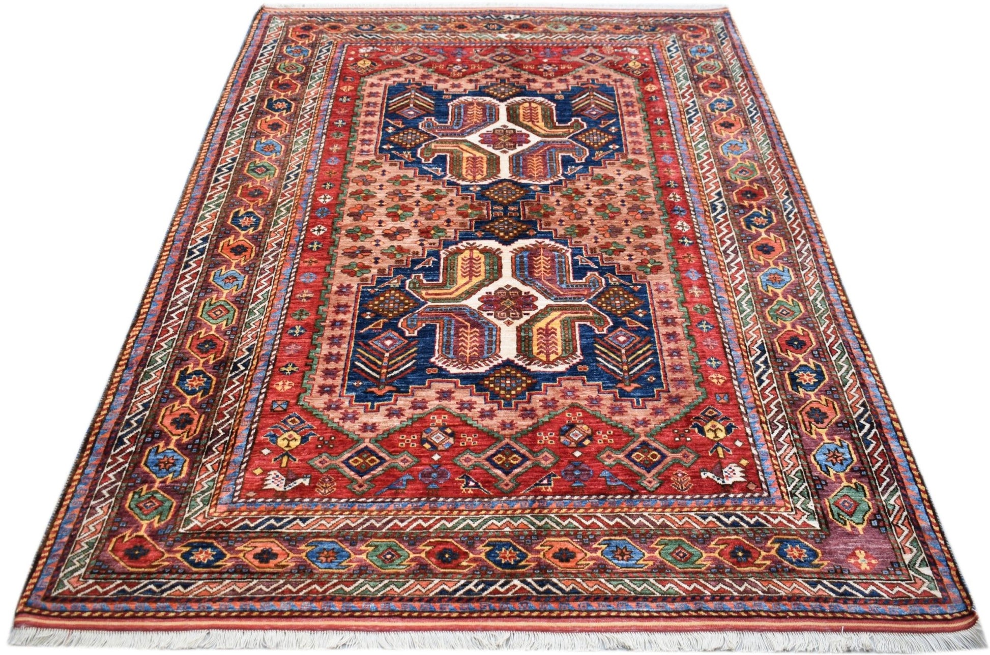A rectangular Afghan Herati rug featuring a traditional geometric pattern in red and blue tones.