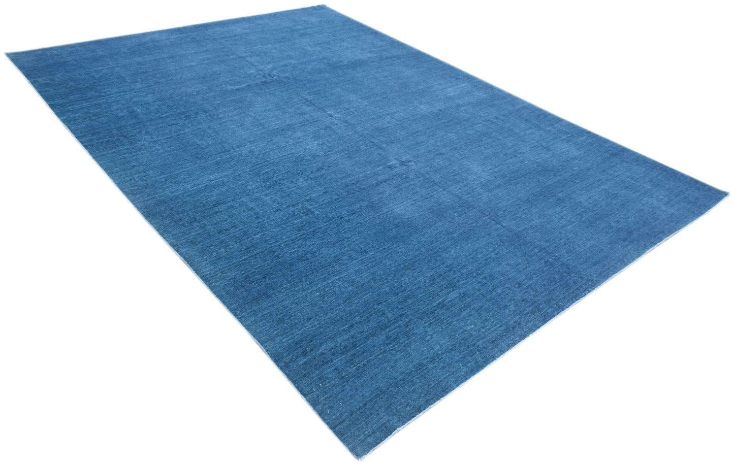 A rectangular, handwoven Afghan Chobi rug featuring a solid, textured blue wool surface.