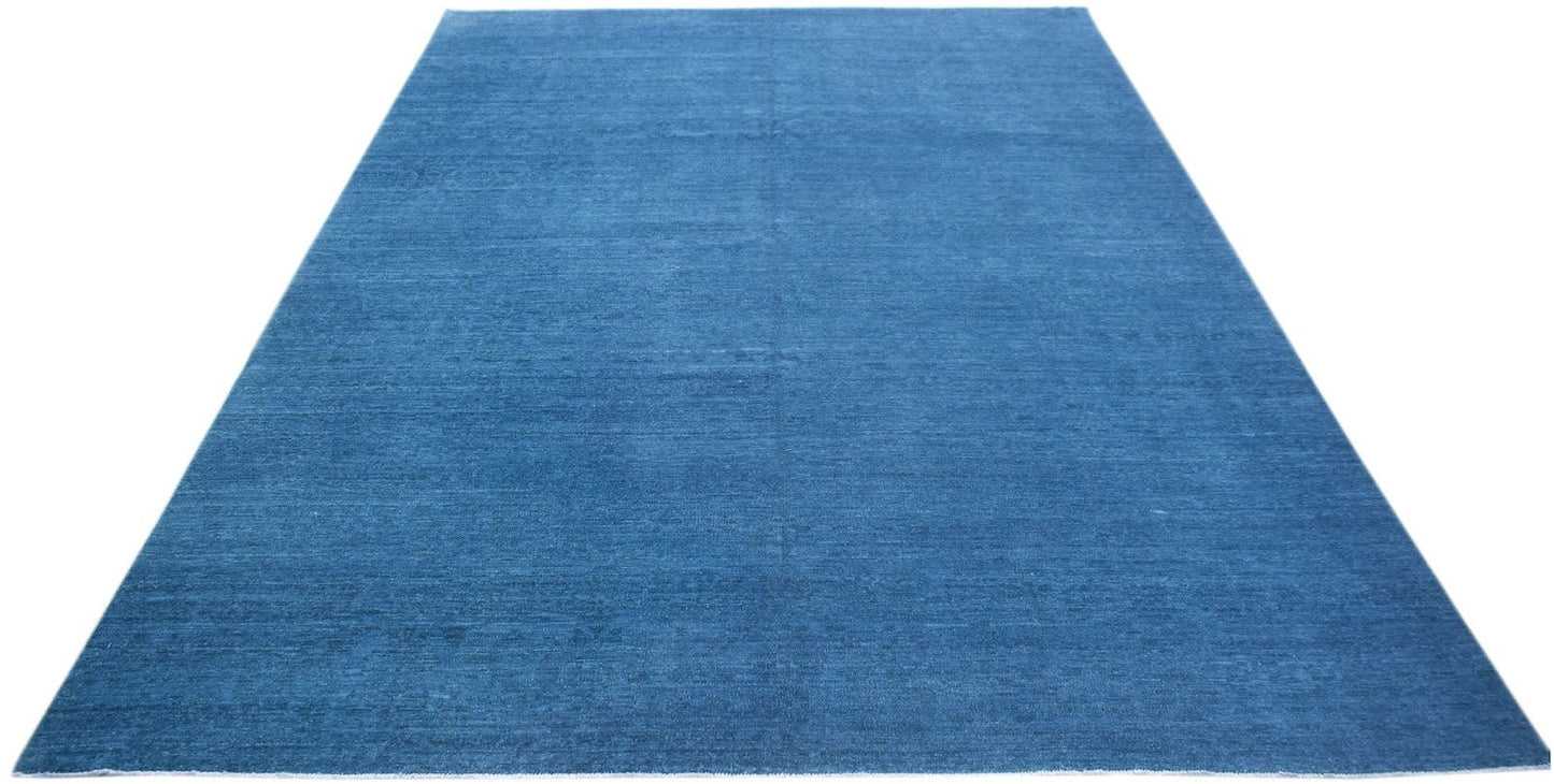 A rectangular, handwoven Afghan Chobi rug featuring a solid, textured blue wool surface.