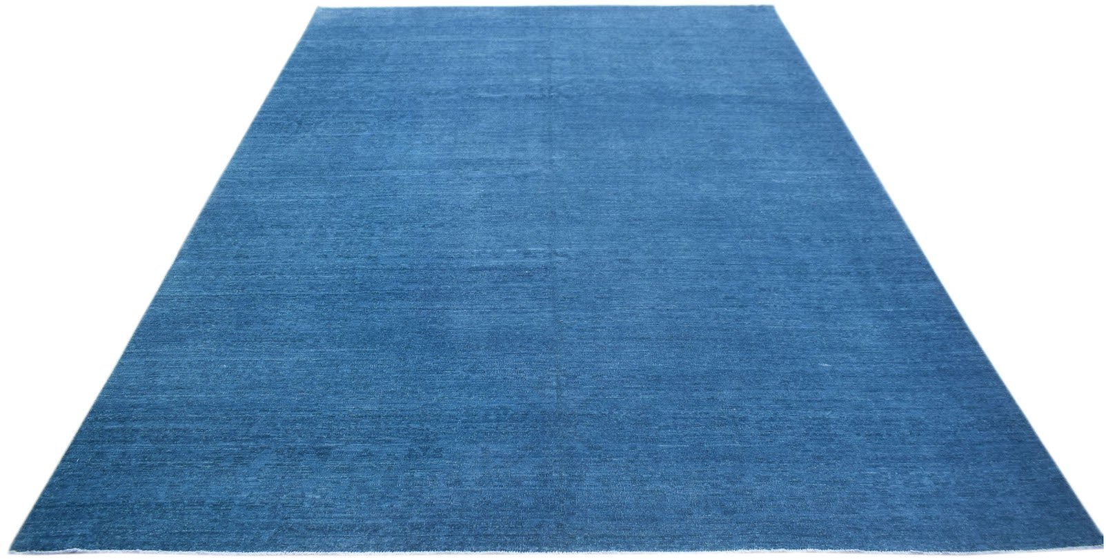 A rectangular, handwoven Afghan Chobi rug featuring a solid, textured blue wool surface.