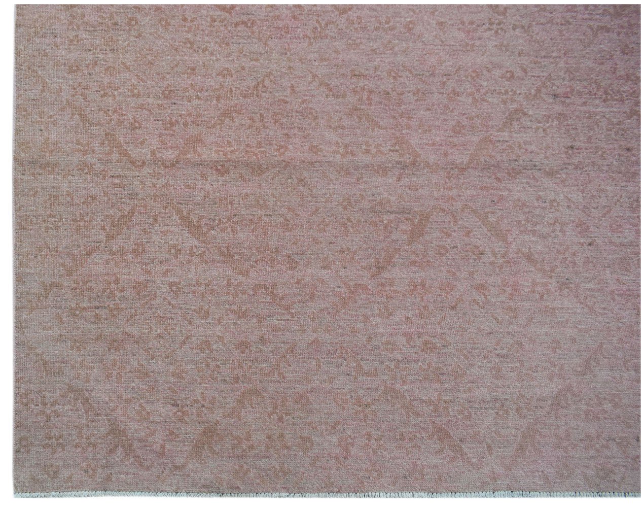 A handmade Afghan Chobi rug featuring a subtle, traditional floral pattern in soft pink tones.