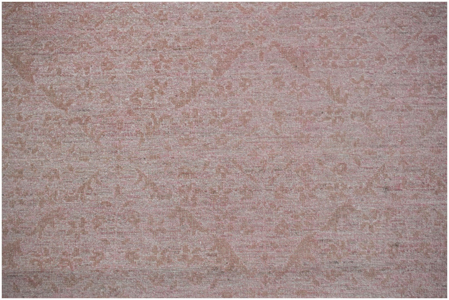 A handmade Afghan Chobi rug featuring a traditional floral pattern in soft pink and beige tones.