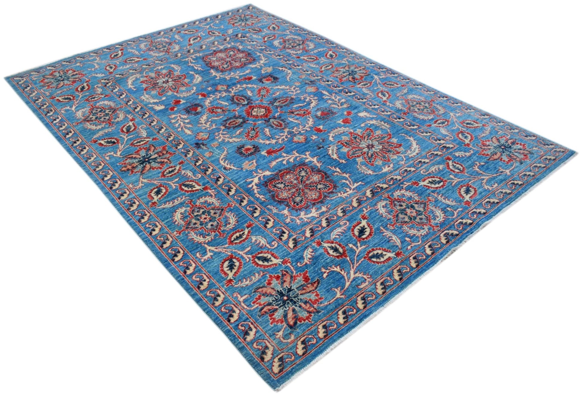 A rectangular Afghan Chobi rug featuring a blue field with intricate red and cream floral motifs.