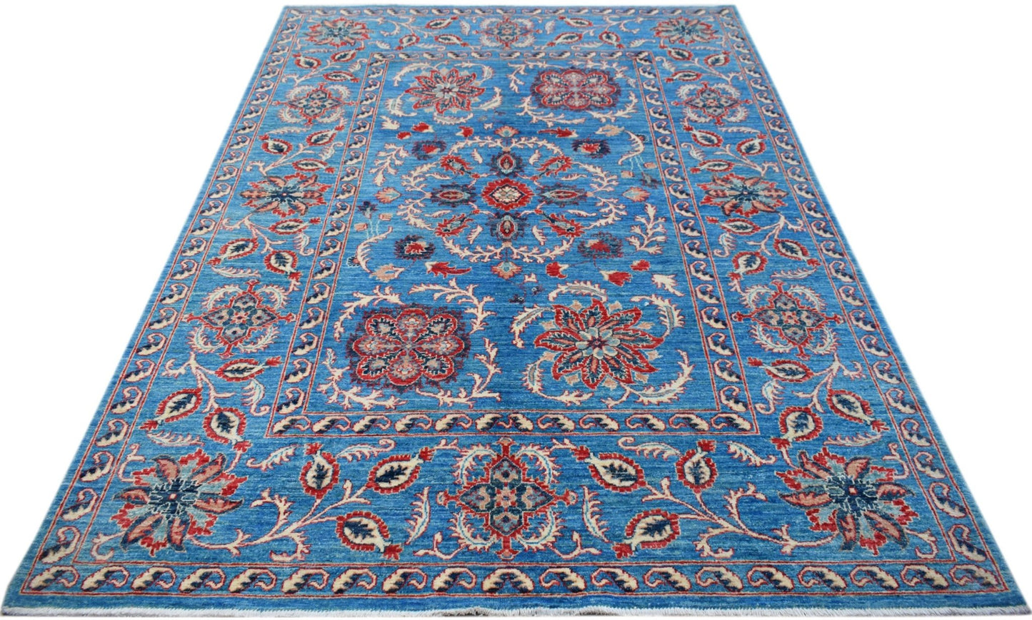 A rectangular Afghan Chobi rug featuring traditional Suzani floral motifs in red and blue tones.