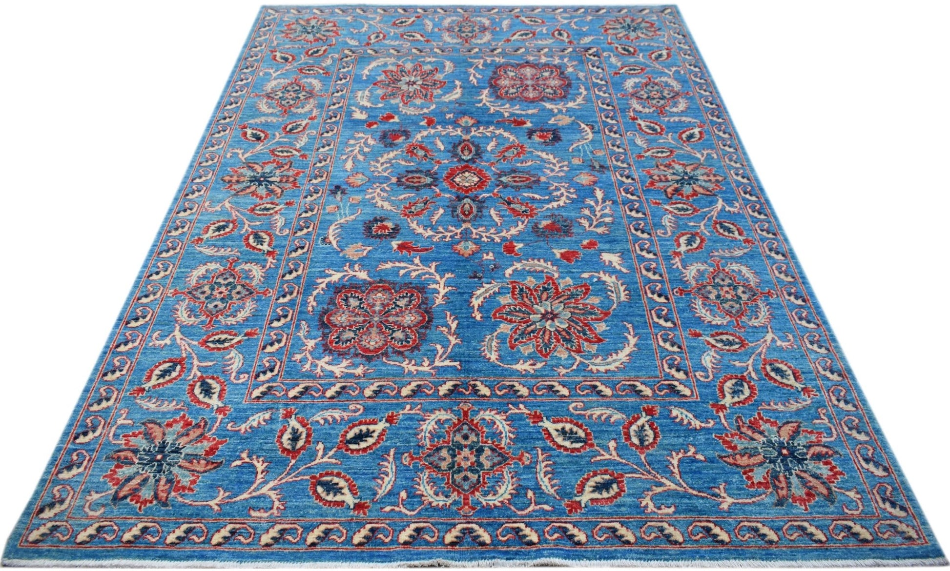 A rectangular Afghan Chobi rug featuring traditional Suzani floral motifs in red and blue tones.
