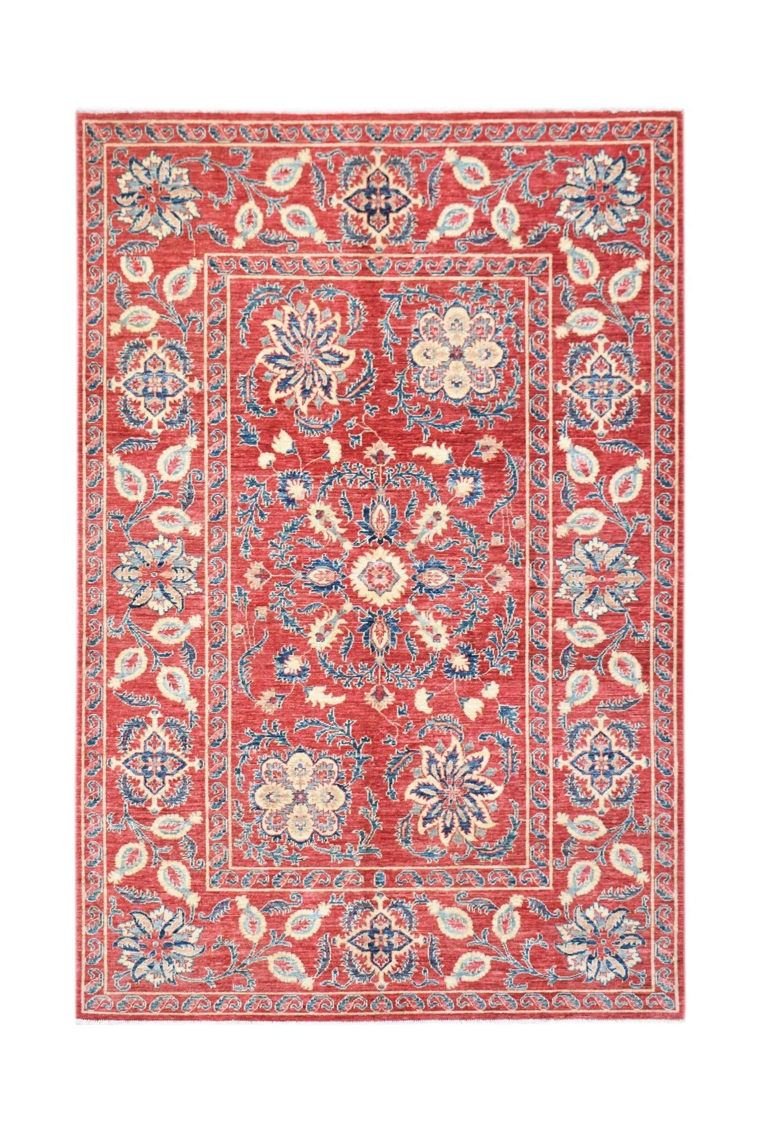 Handwoven Afghan Chobi rug featuring a red field with intricate blue and cream floral Suzani motifs.