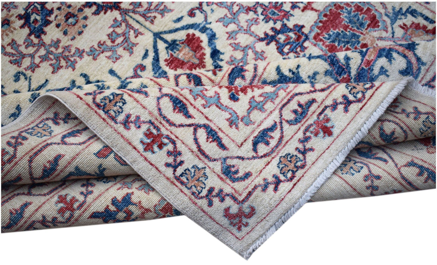 A handmade Afghan Chobi rug featuring a traditional Suzani floral pattern in red and blue tones.