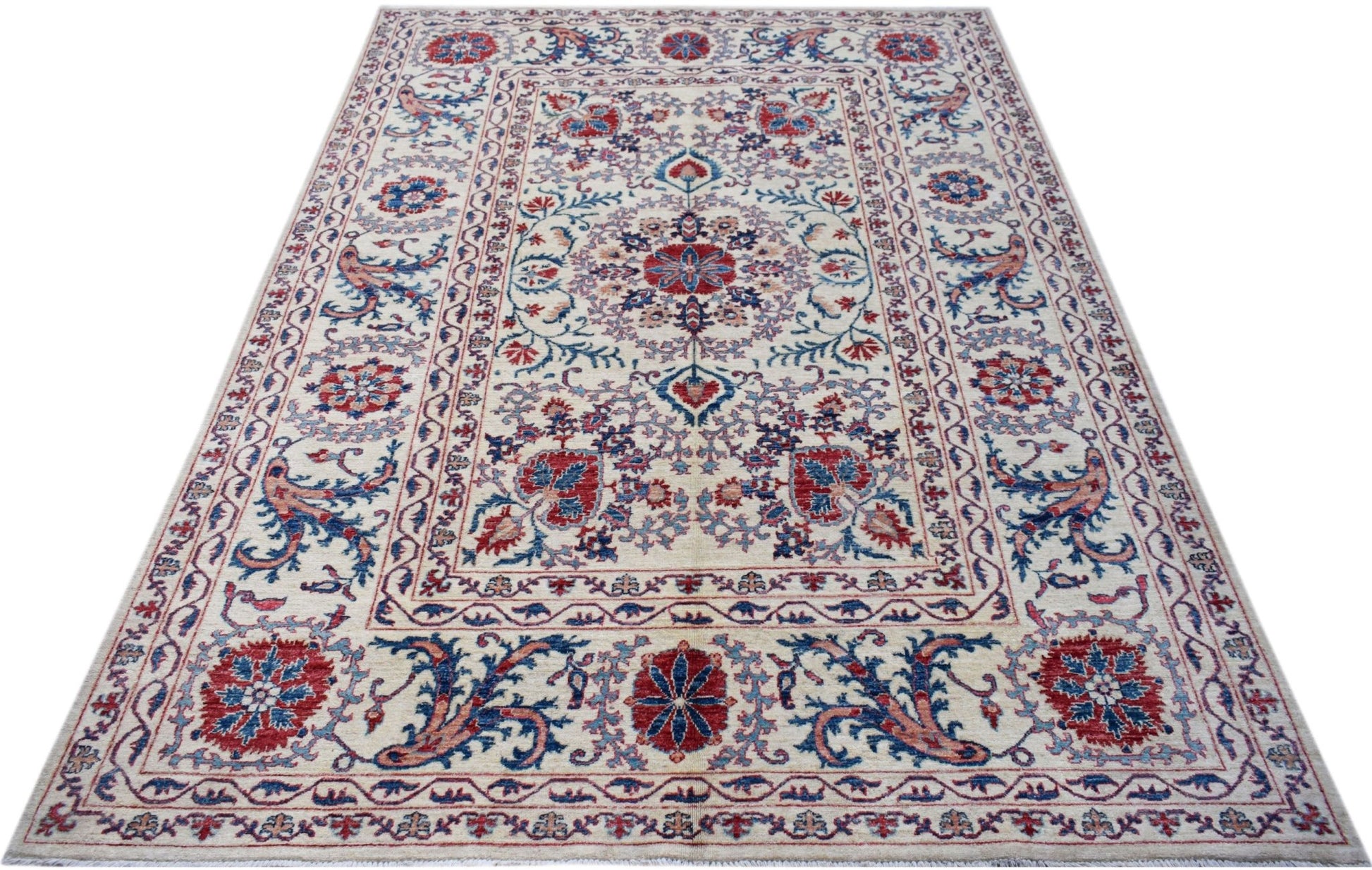 An Afghan Chobi rug featuring a traditional Suzani floral pattern in red and blue on a cream base.