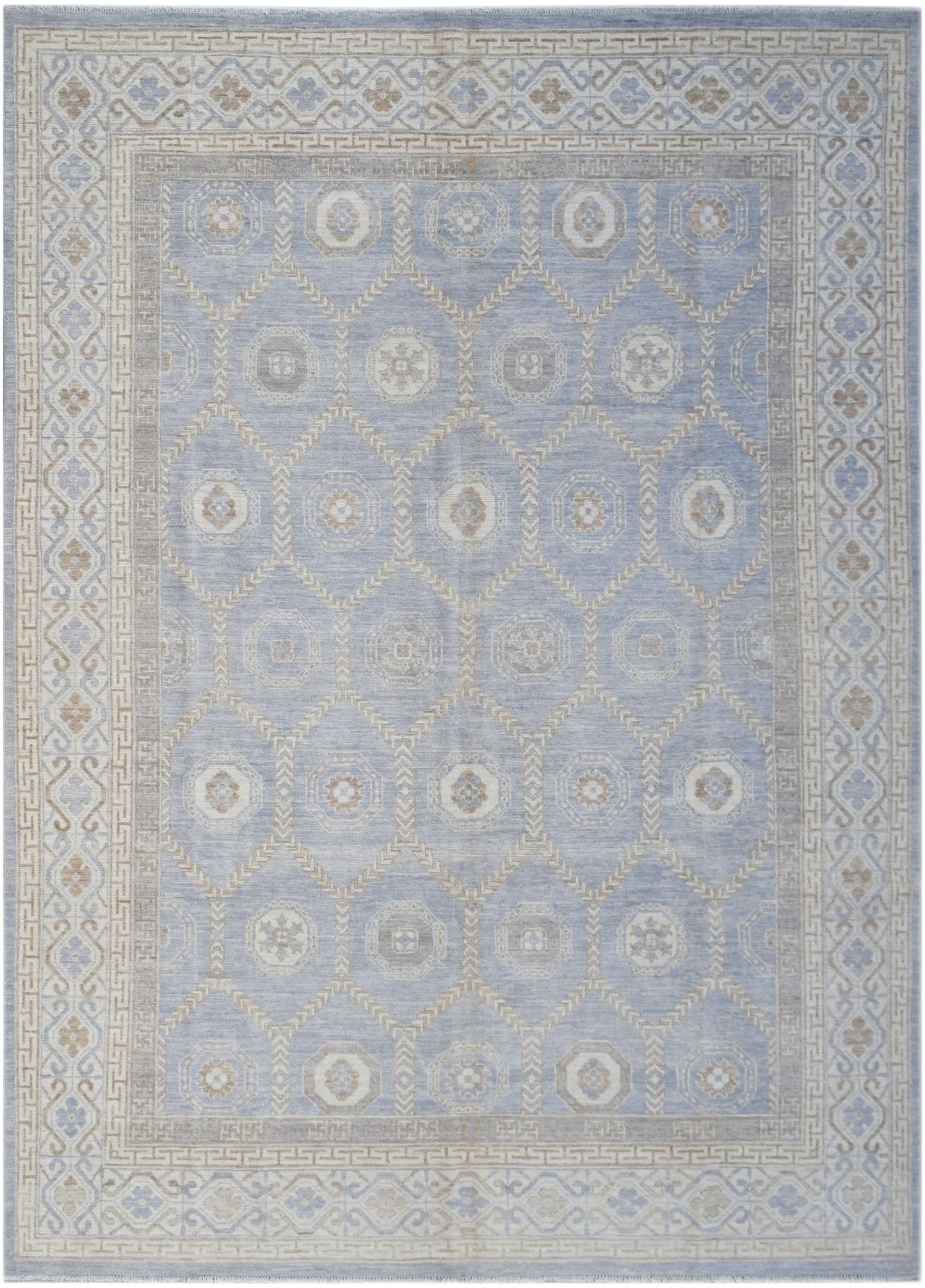 A handmade wool Oushak rug featuring a light blue field with a geometric Khotan medallion pattern.