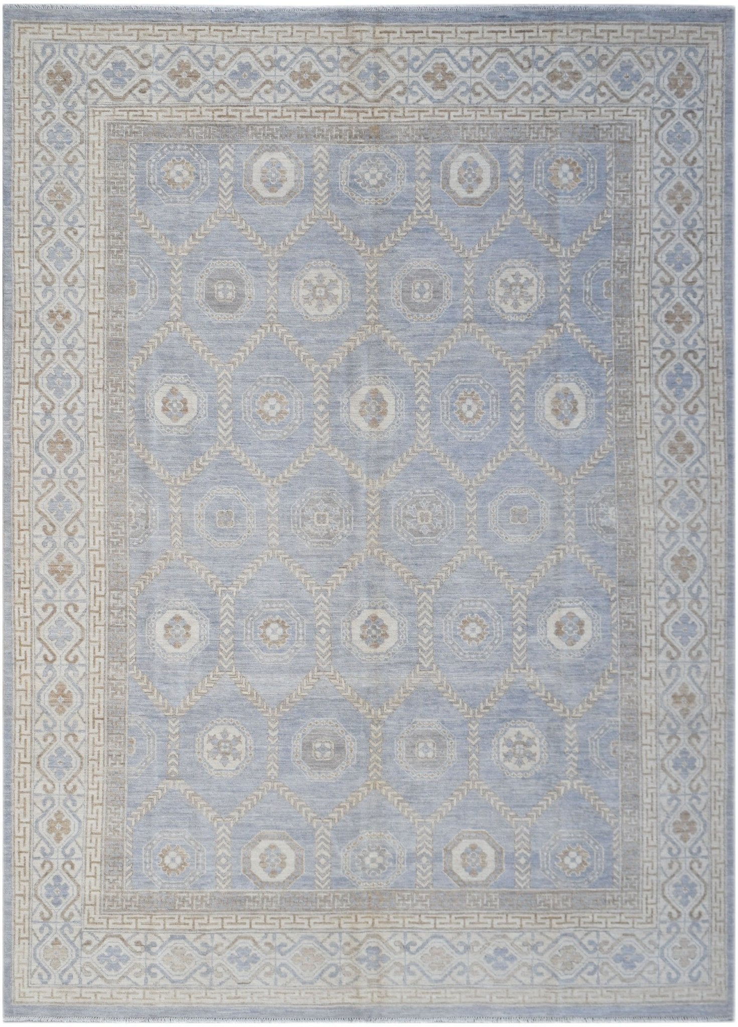 A handmade wool Oushak rug featuring a light blue field with a geometric Khotan medallion pattern.