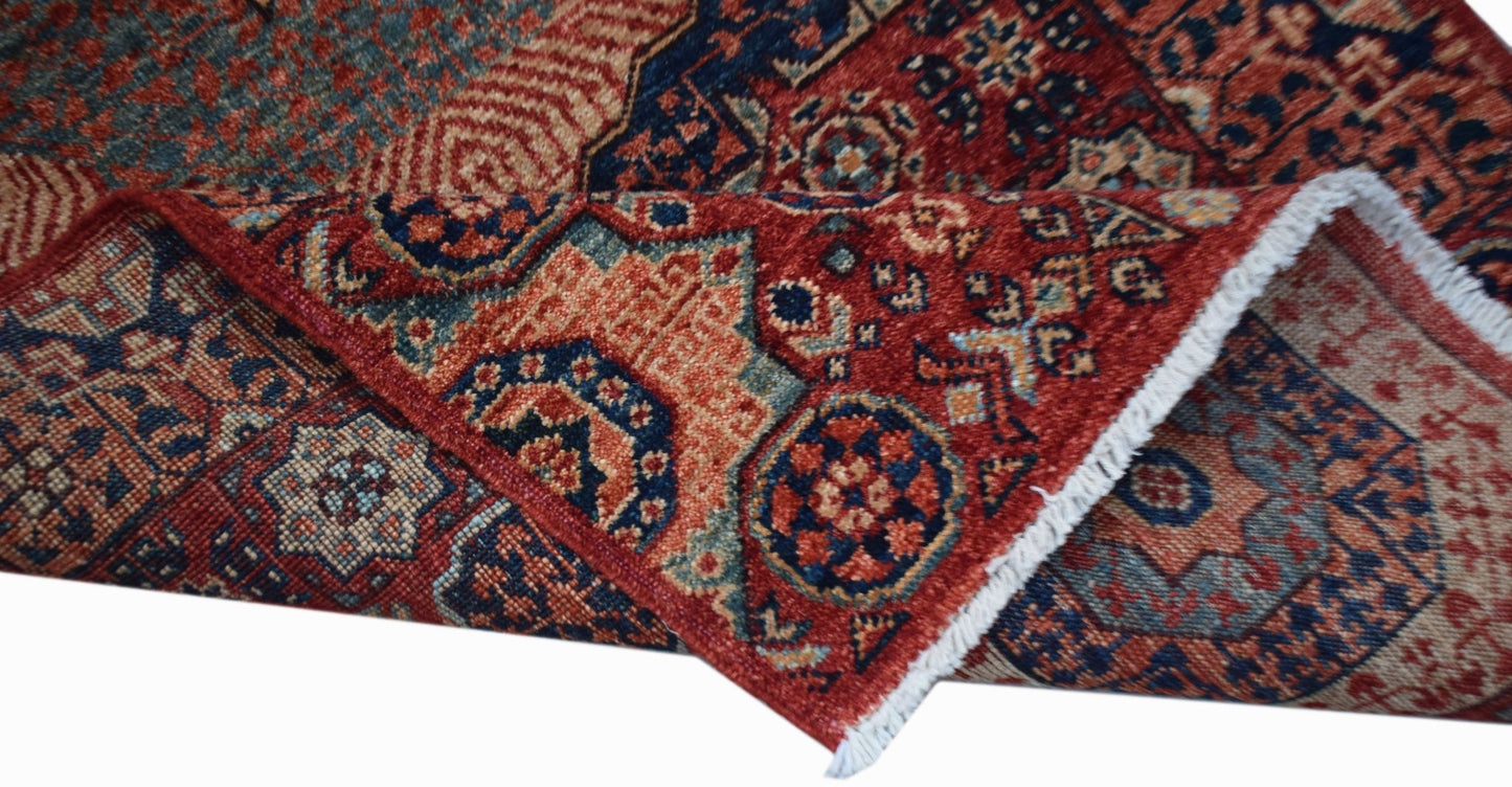 A handmade Afghan Chobi runner featuring a traditional Mamluk medallion pattern in red and blue.