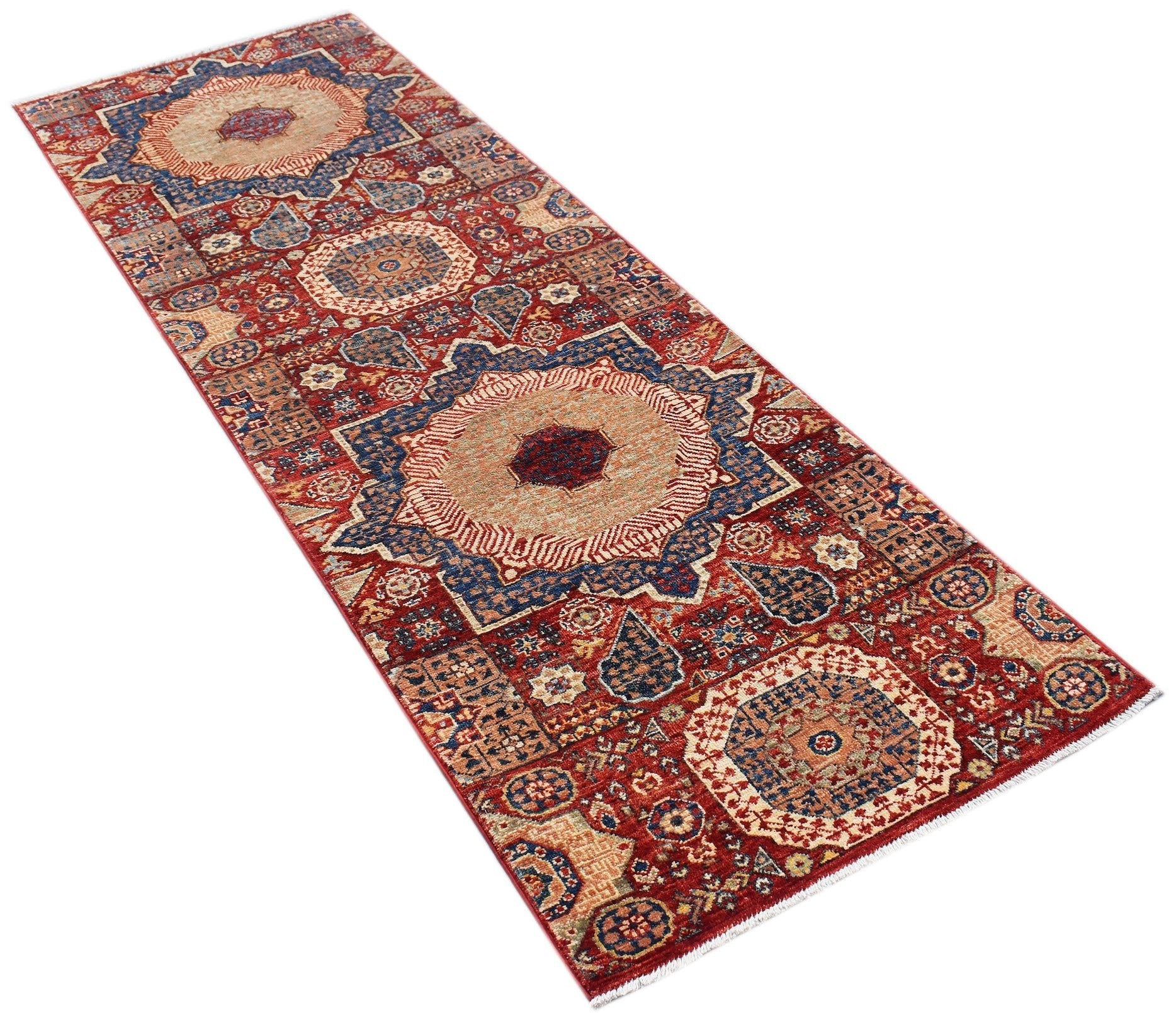 A handmade Afghan Chobi runner rug featuring a traditional red Mamluk pattern with large medallions.