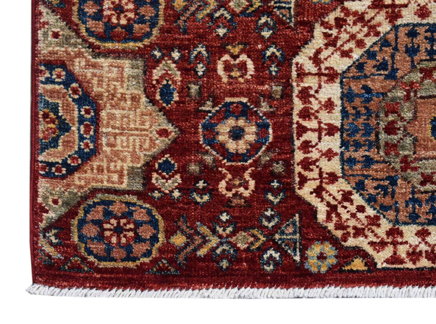 A handmade Afghan Chobi runner featuring a traditional Mamluk medallion pattern in red and blue.