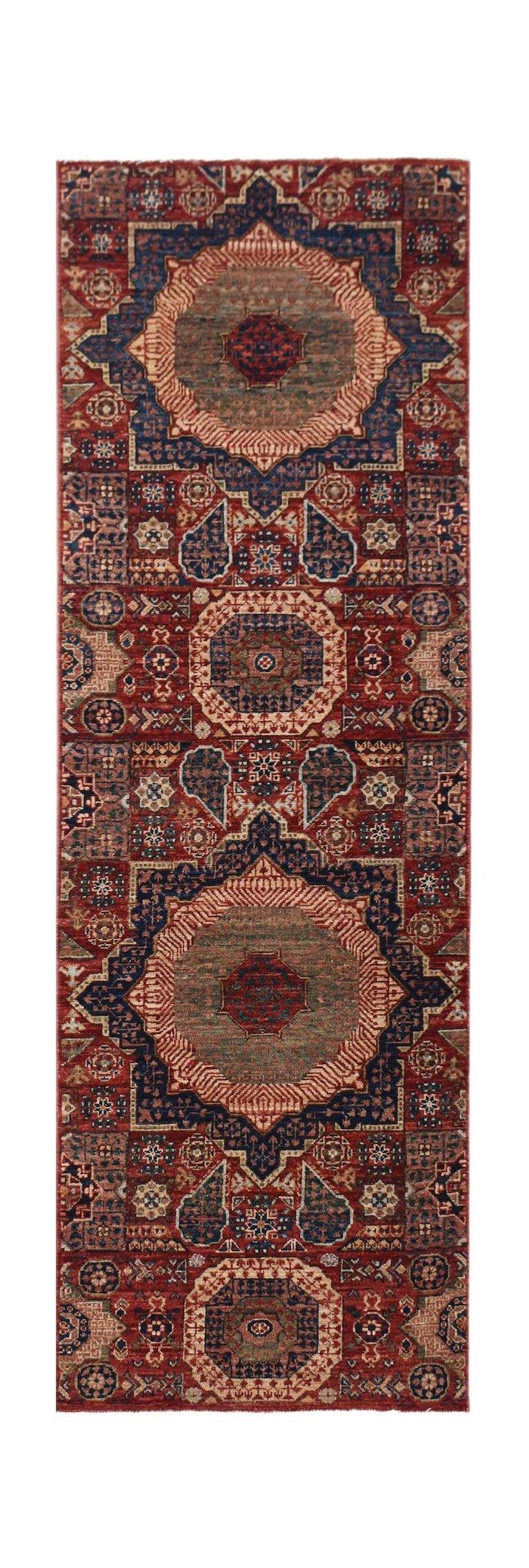 A handmade Afghan Chobi runner rug featuring a traditional Mamluk medallion pattern in red and blue.