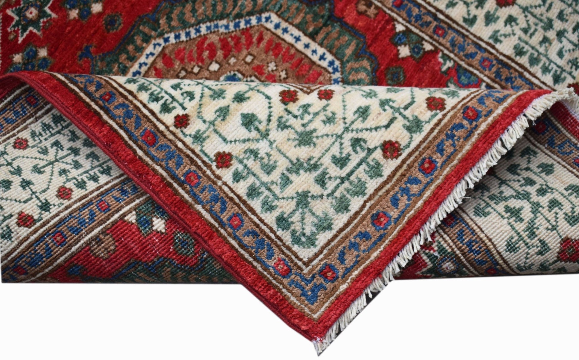 A handwoven Afghan Chobi runner featuring a traditional Mamluk pattern in red, green, and cream.
