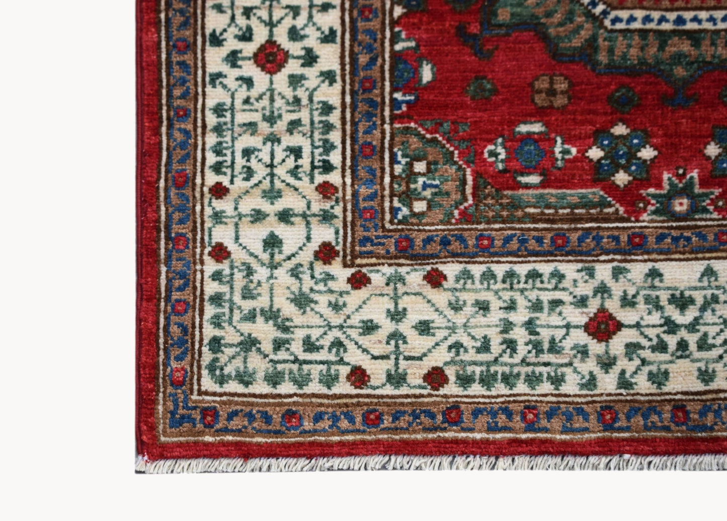 A handmade Afghan Chobi runner featuring a traditional Mamluk pattern in red, blue, and cream.
