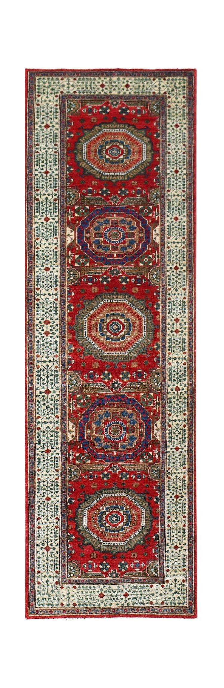 A handmade Afghan Chobi runner featuring a red field with repeating Mamluk medallions.