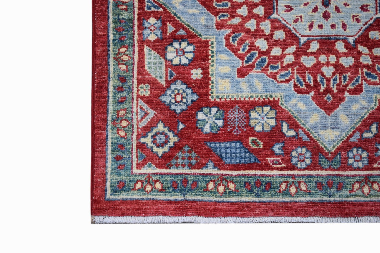 A handmade Afghan Chobi runner featuring a traditional red and blue Mamluk medallion pattern.