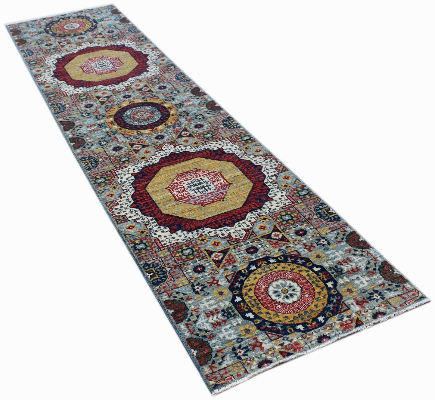 A handmade Afghan Chobi runner rug featuring a traditional Mamluk medallion pattern in wool.