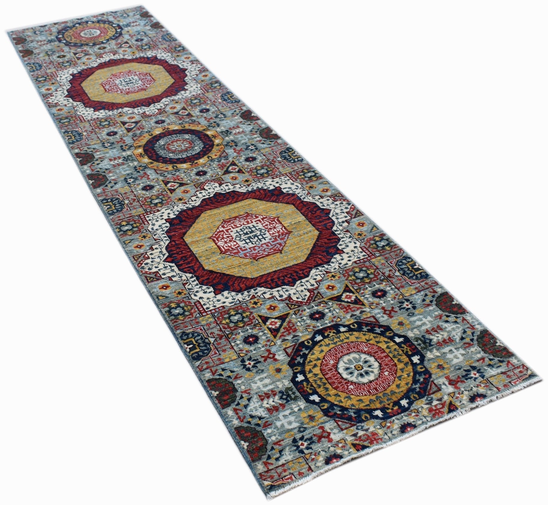 A handmade Afghan Chobi runner rug featuring a traditional Mamluk medallion pattern in wool.